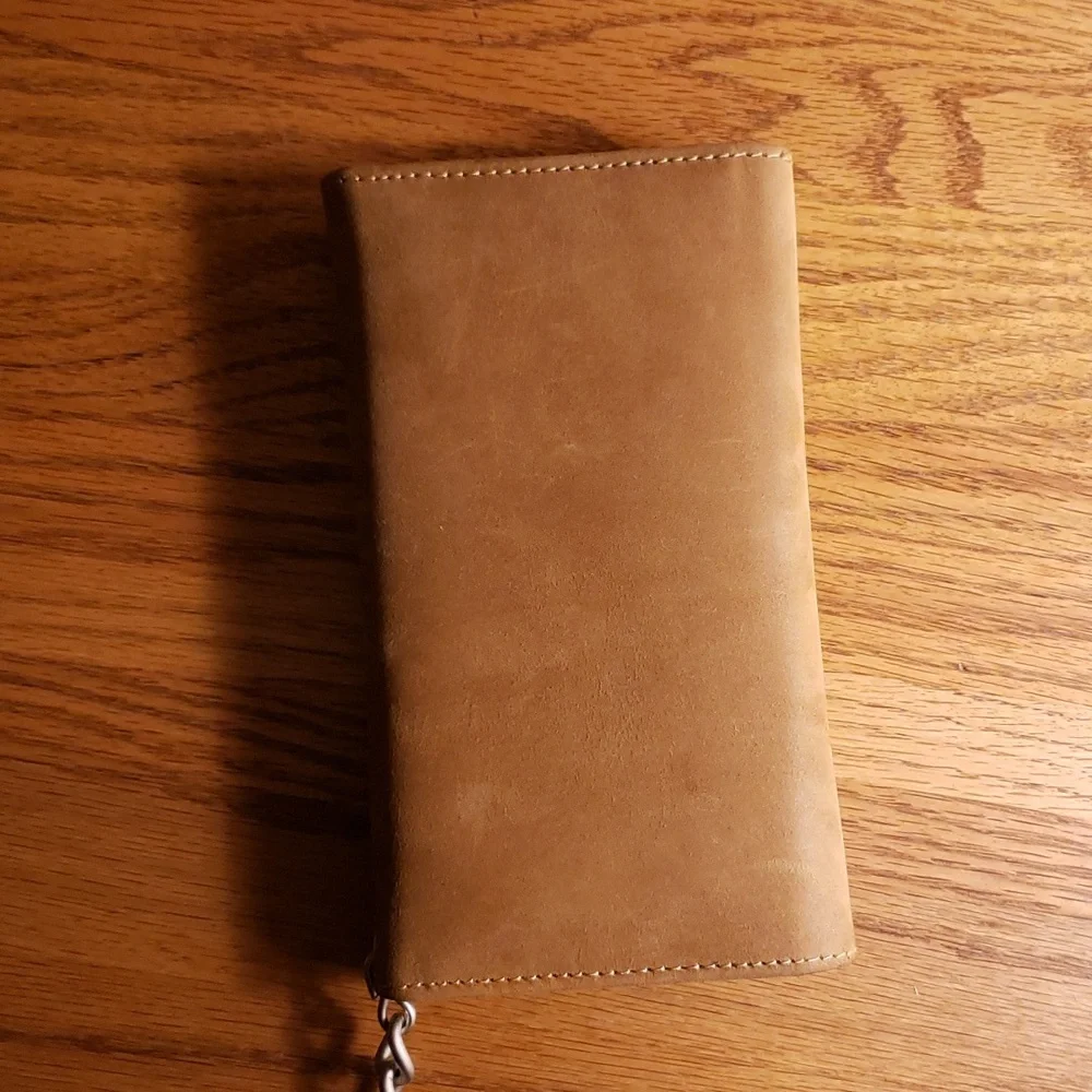 Unbranded tri-fold brown leather wallet with 19